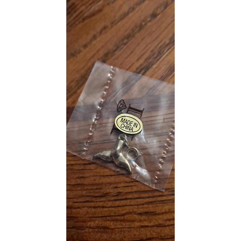 Gold-tone Whale Tale Charm from Diamonds International